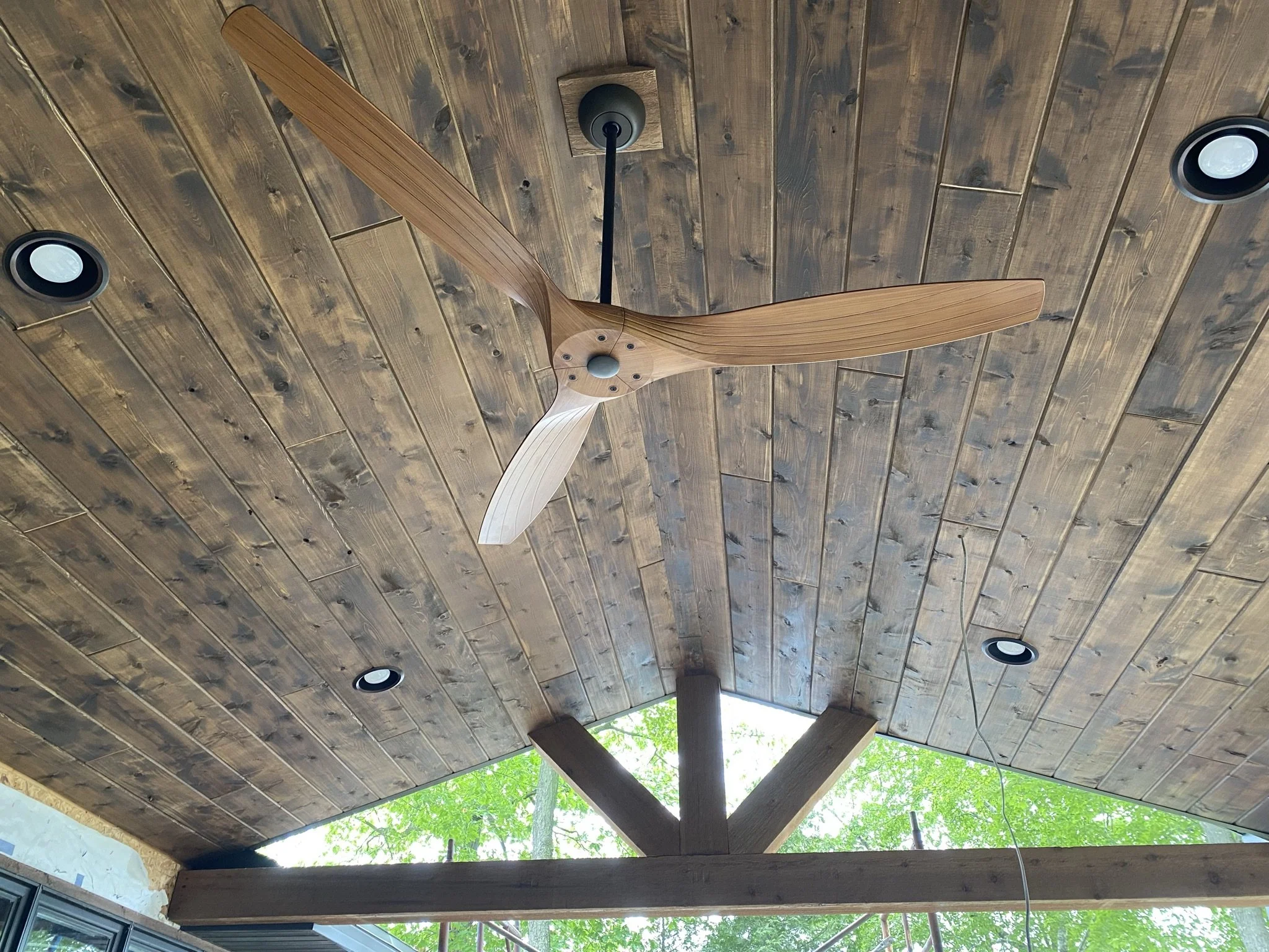 Stained rustic cedar tongue and groove ceiling, with inset led can lighting 