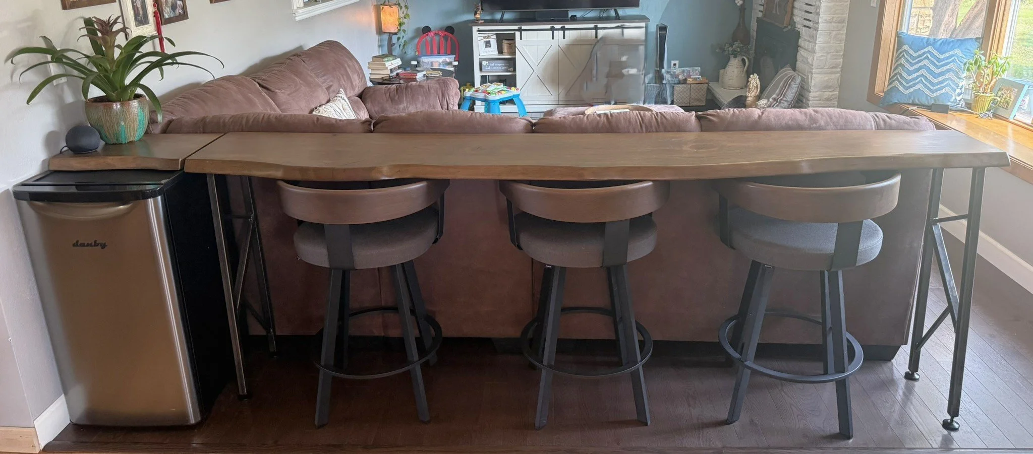Rustic live edge black cherry console table with custom designed and built steel legs, and matching cutting board