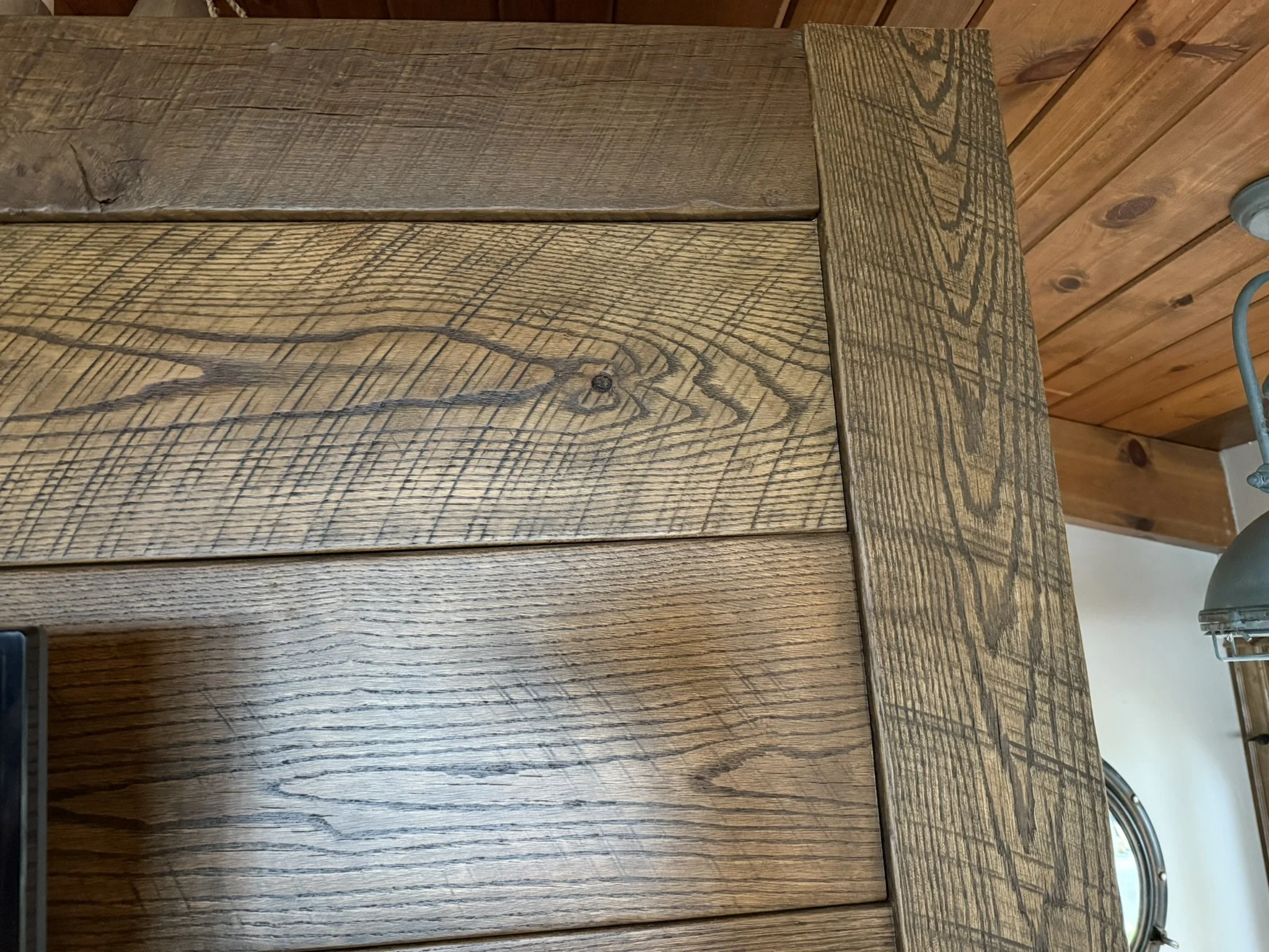 Rustic stained oak accent wall with original saw marks