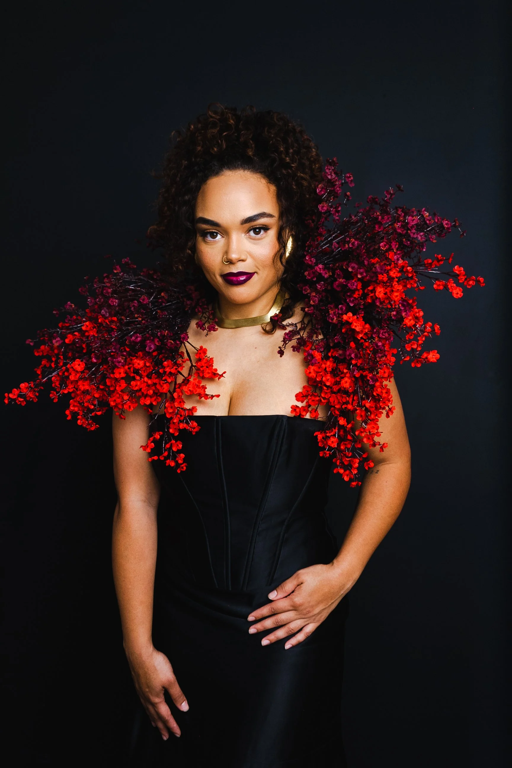woman wearing a red floral cape