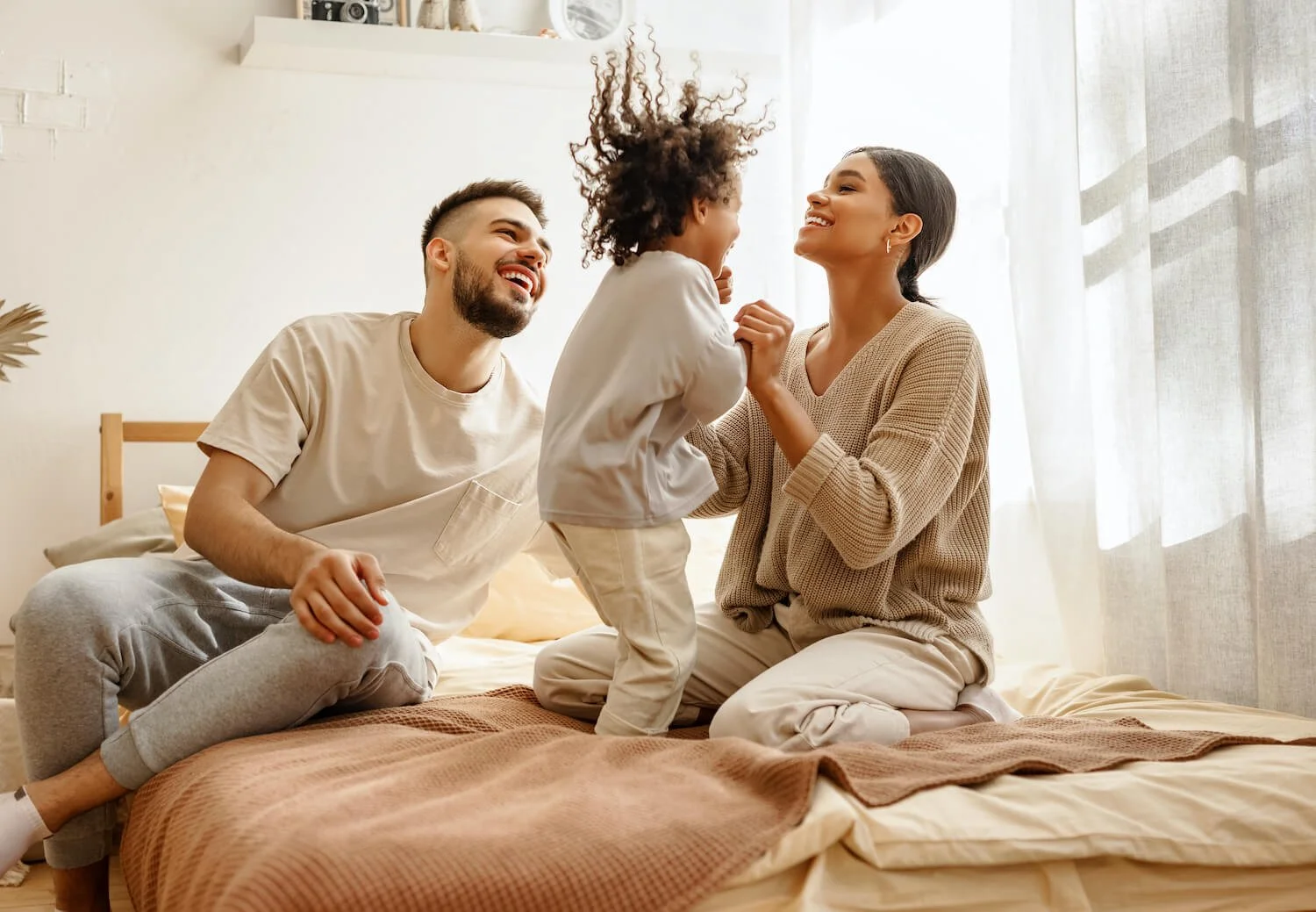 Family sharing a joyful moment together after emotional healing
