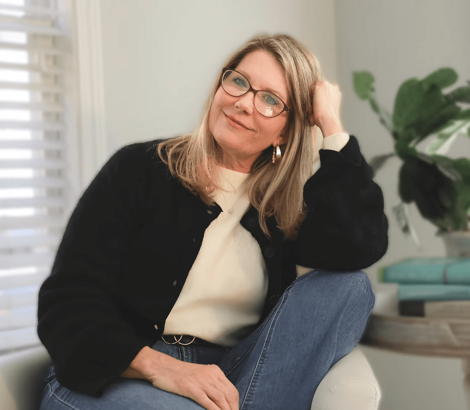 Therapist smiling in a calm and welcoming space, creating a safe place to connect