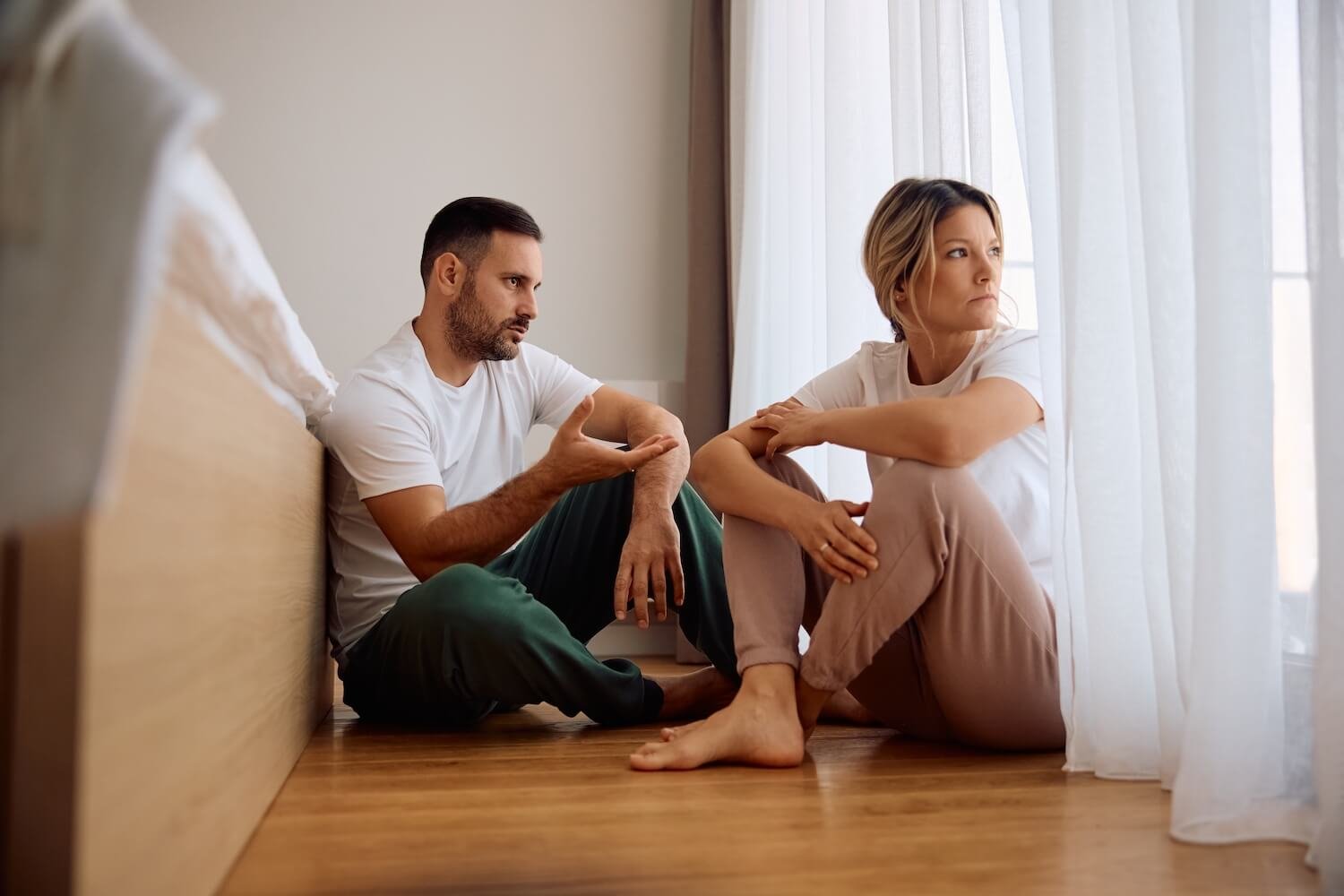 Woman sitting alone feeling emotionally withdrawn and processing difficult emotions