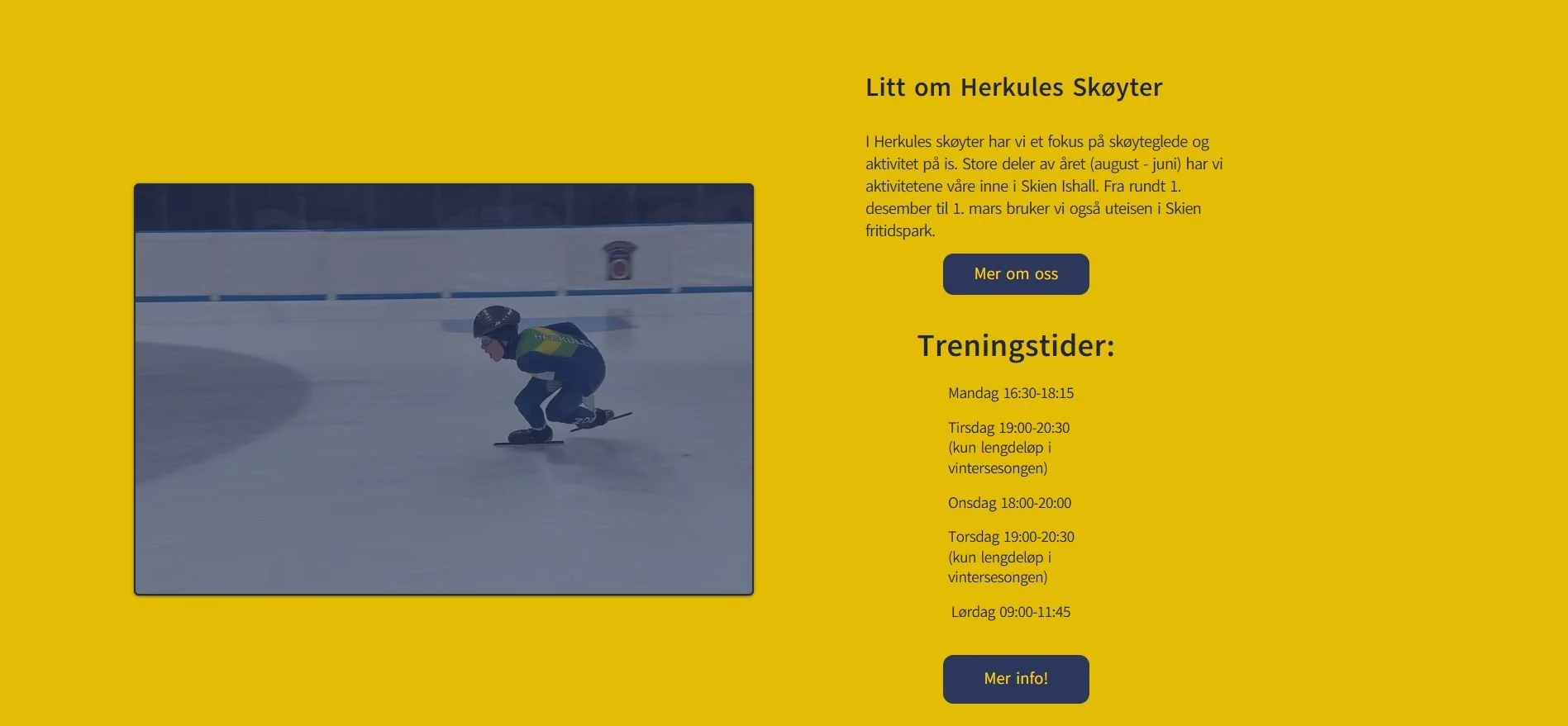 A young person in a green and blue jacket and helmet skating on an indoor ice rink.