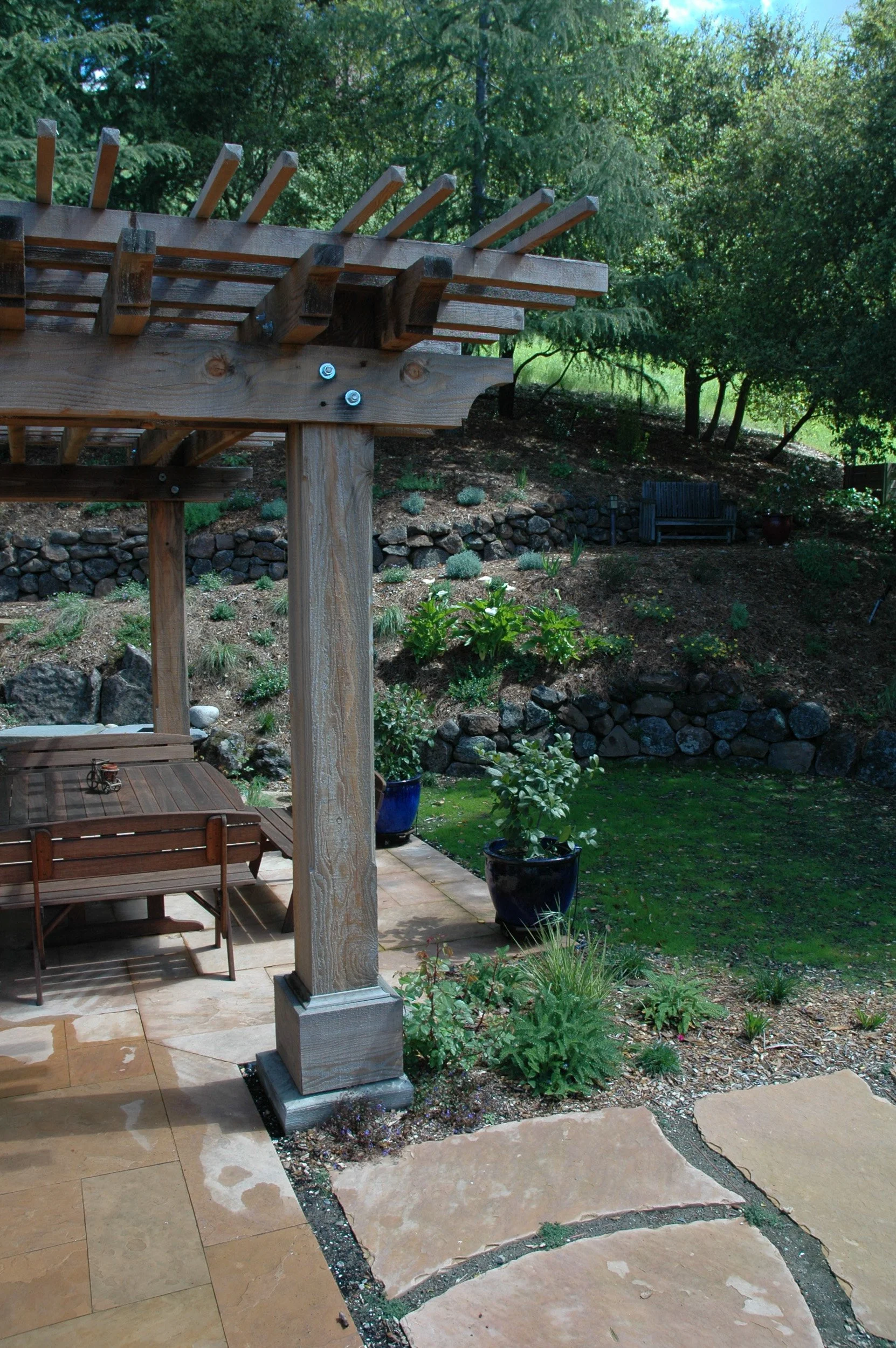 Overhead wood pergola arbor garden japanese style california native plant garden stone patio