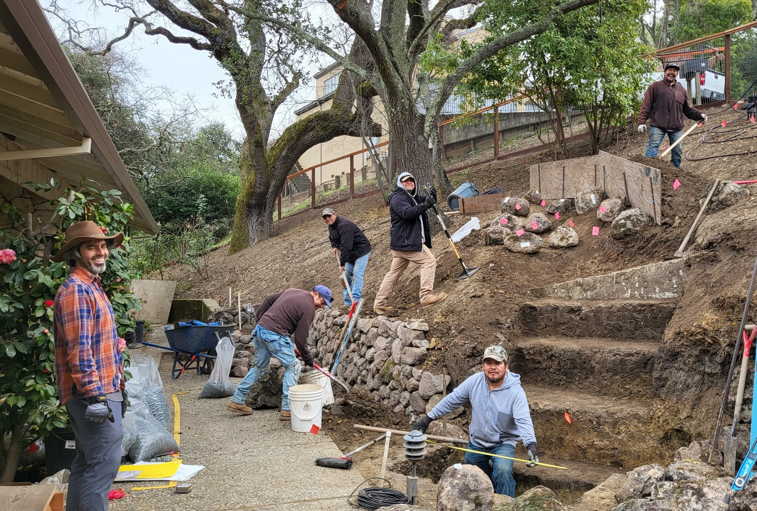 Landscape installation slope hillside rock oak tree california native garden