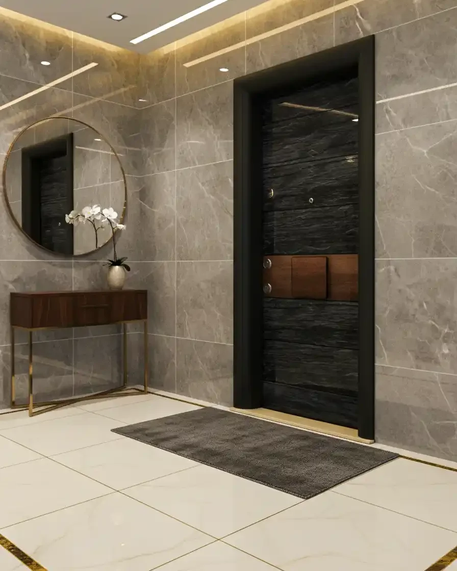 Elegant hotel lobby with marble walls, a round mirror, a wooden console table with gold legs, a decorative vase with white flowers, and a dark wooden door with peephole and locks, a gray doormat on large cream-colored tile flooring.