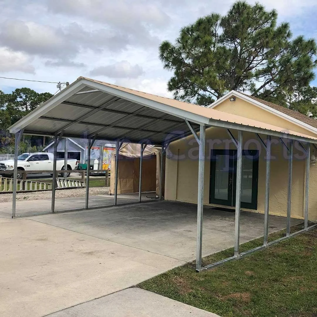 Metal garage and carport in wooded area