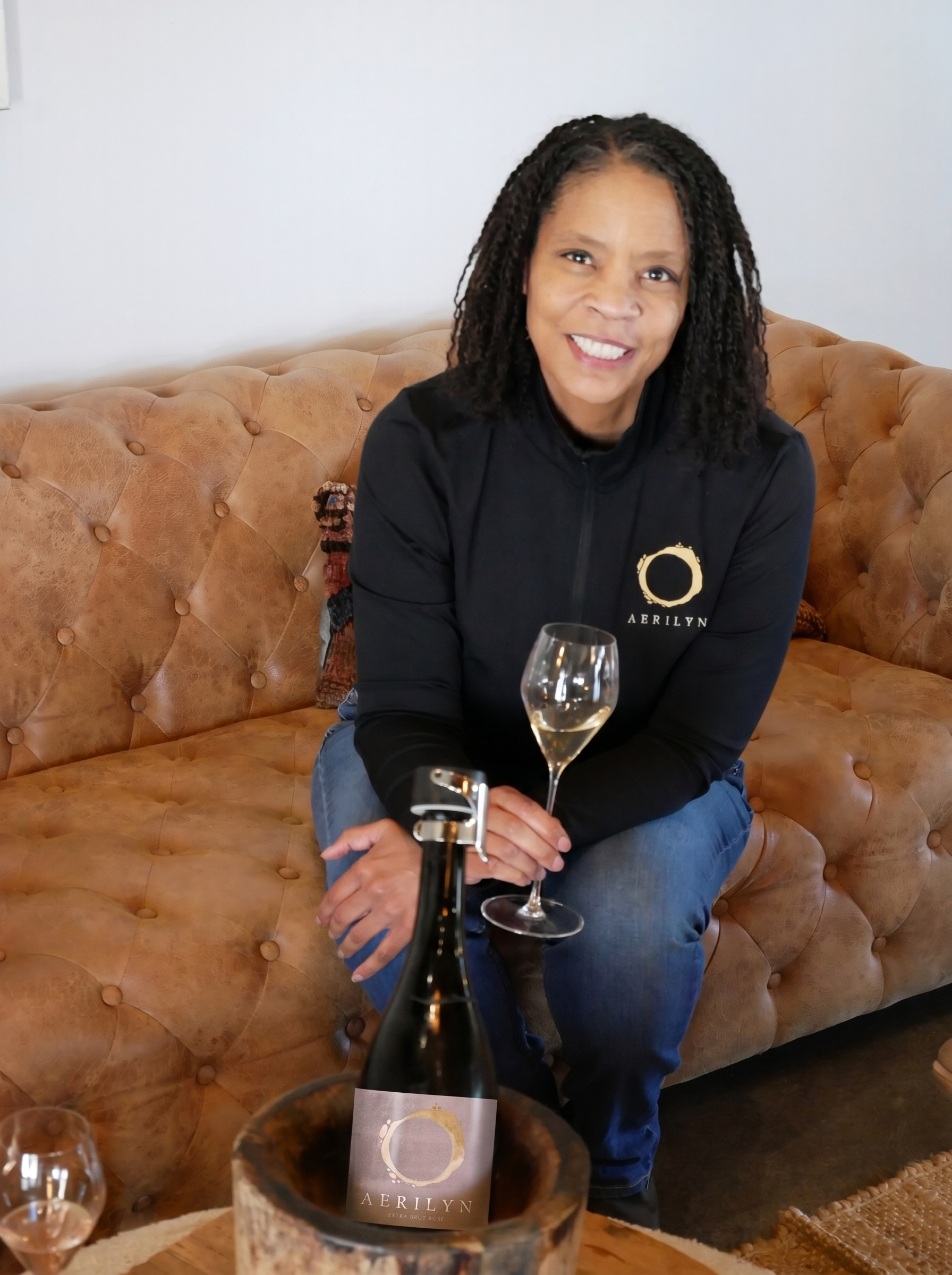 Tammee Thompson with a bottle of AERILYN Rosé.