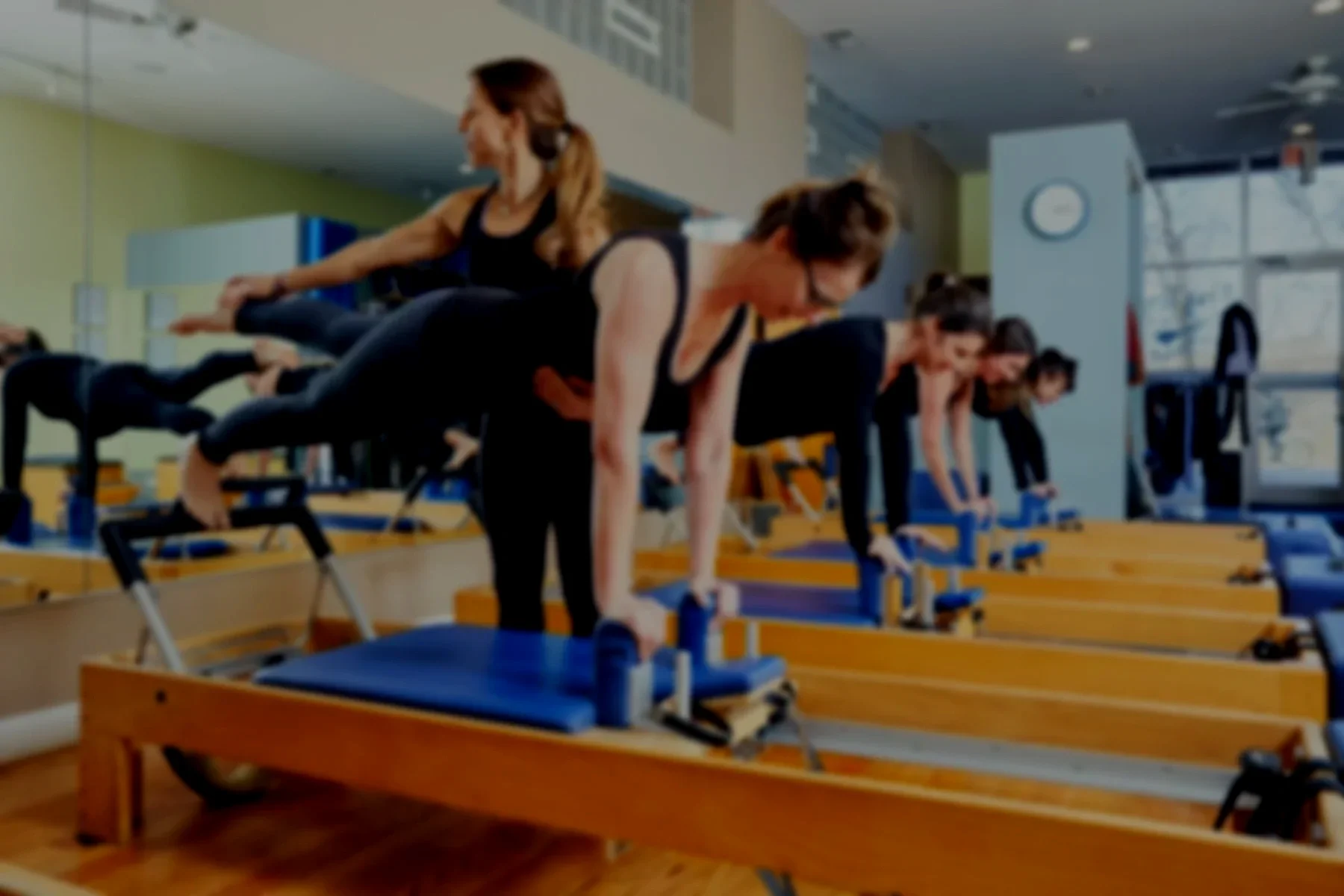 group-pilates-class-women-strength-mobility-instructor-led.webp