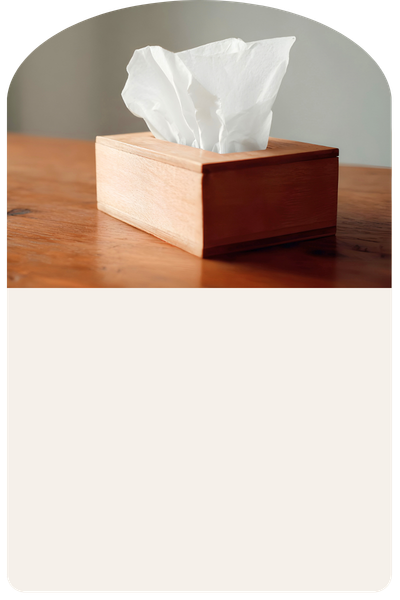 A tissue box on a warm wooden surface, symbolizing the emotional release at the center of Acceptance and Commitment Therapy for anxiety, grief, and burnout.