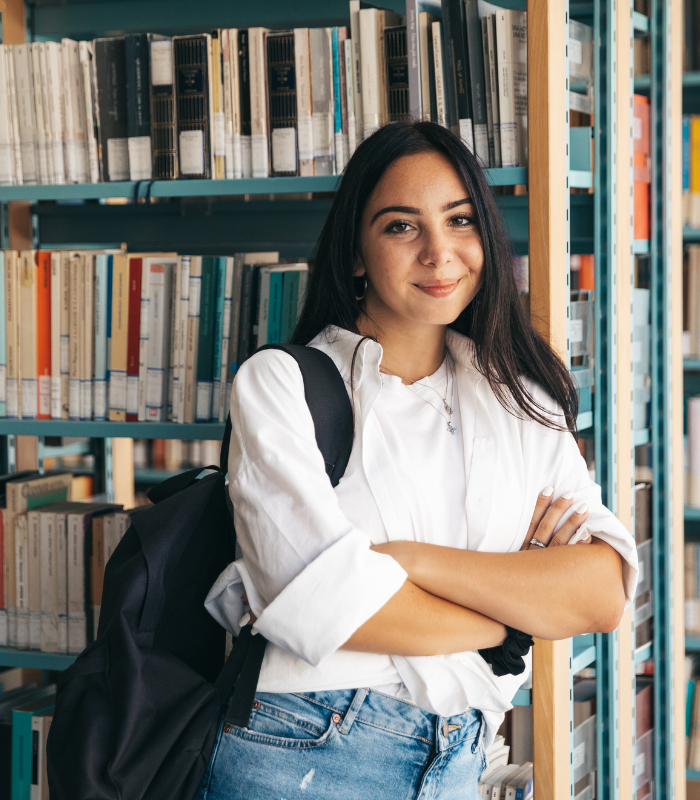 Graduate student in a university library, representing the public affairs students Mollie Stephens supports through her career planning curriculum.