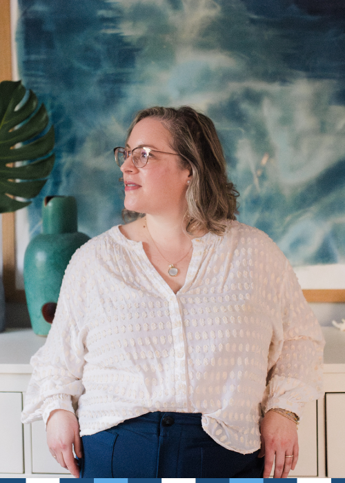 A mission-driven professional pauses in quiet reflection — representing the self-aware leaders who seek career coaching for nonprofit and public sector professionals ready to figure out what's next.