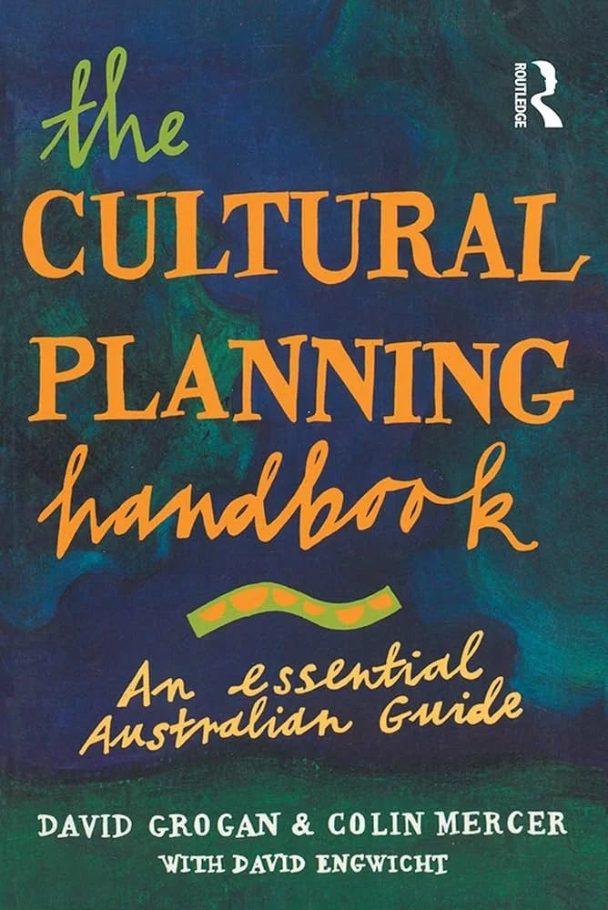 Book cover titled "The Cultural Planning Handbook: An Essential Australian Guide" by David Grogan and Colin Mercer with David Engwicht, featuring a colorful, abstract background.