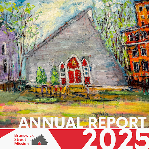 Painting of a gray church with red doors, surrounded by trees and neighboring buildings, with the text 'Annual Report 2025' and 'Brunswick Street Mission' at the bottom.