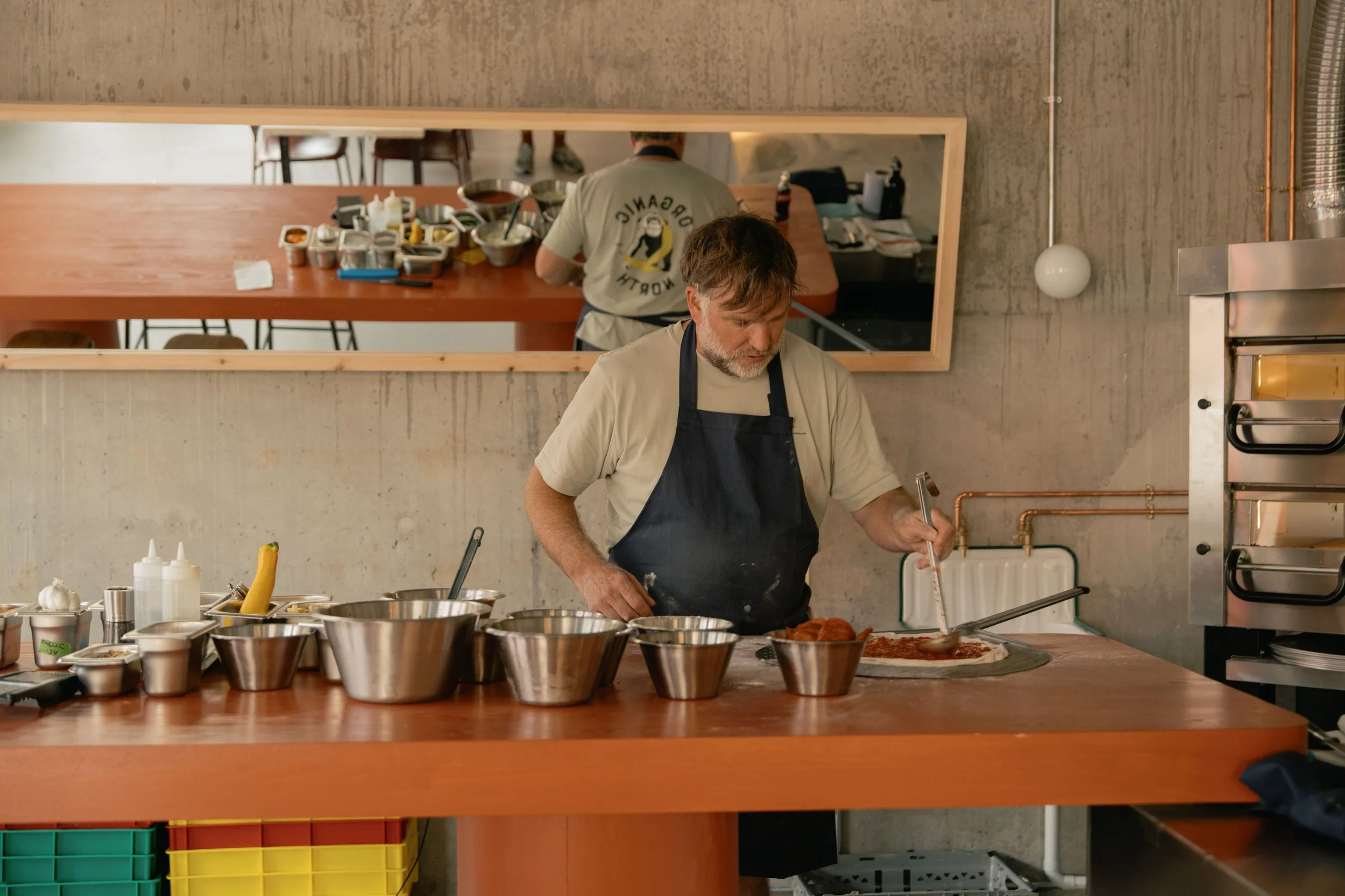 Proloco's chef Richard Carver preparing food in the open kitchen