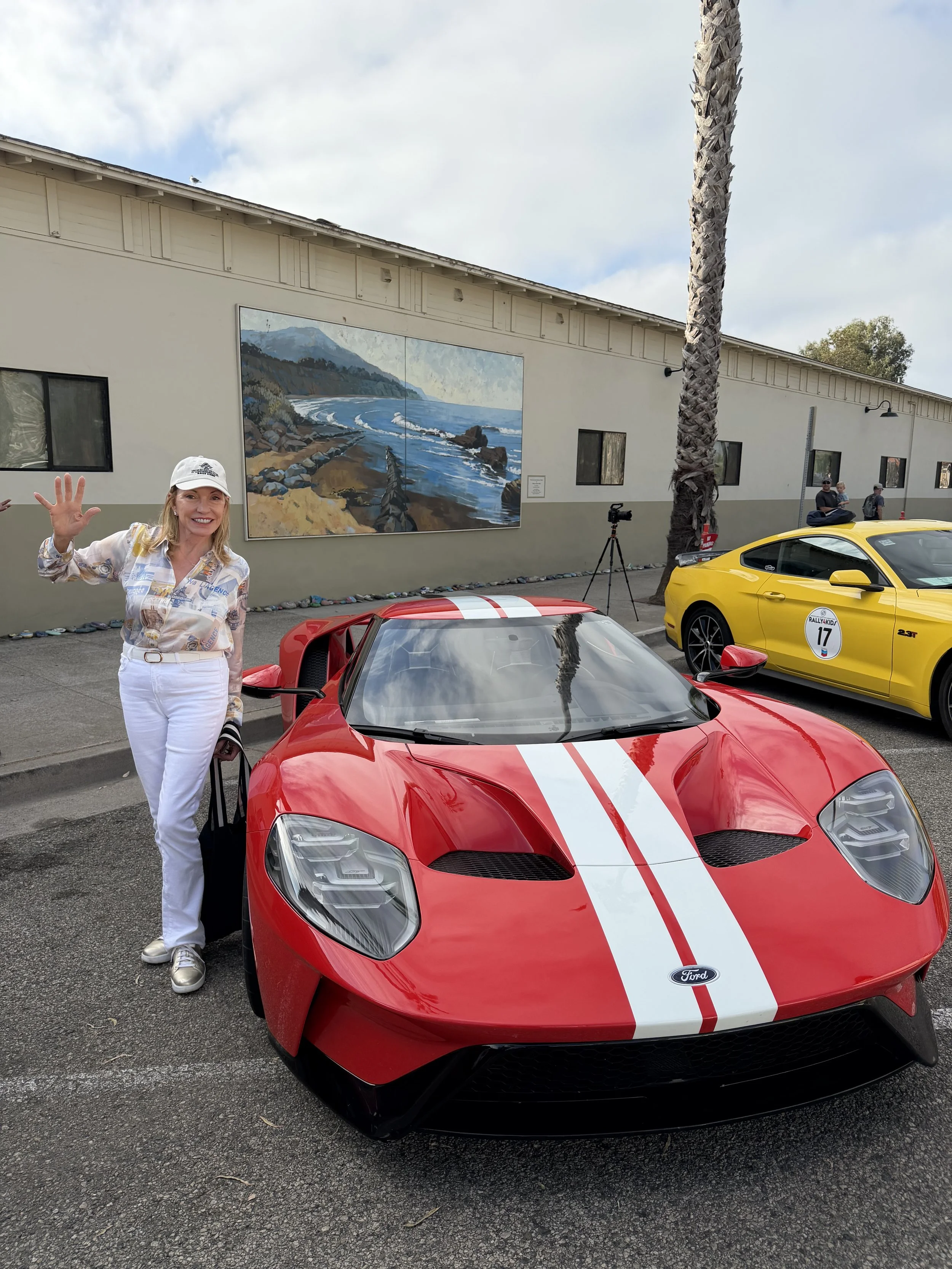 woman-in-white-beside-red-ford-gt-with-white-stripes--6d79273a.jpeg