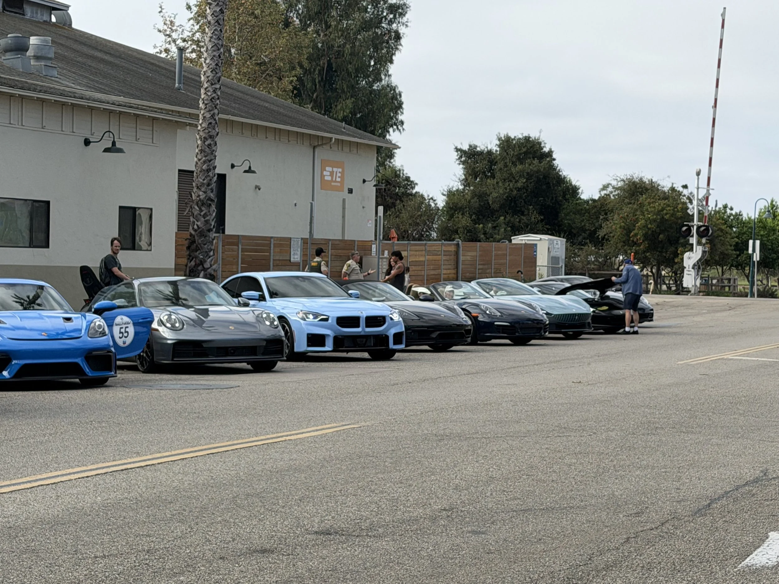 blue-and-gray-sports-cars-beside-wooden-fence--1b6bfd4d.jpeg