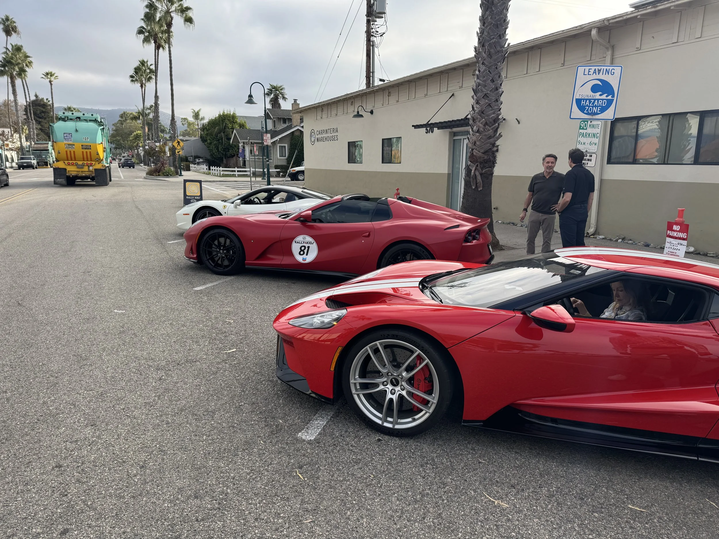 red-sports-cars-parked-on-street-with-rally-number-81--d1fa7c39.jpeg
