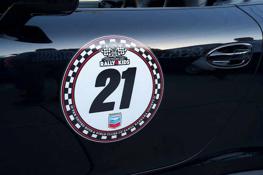 Rally 4 Kids race number 21 sticker on a black car.