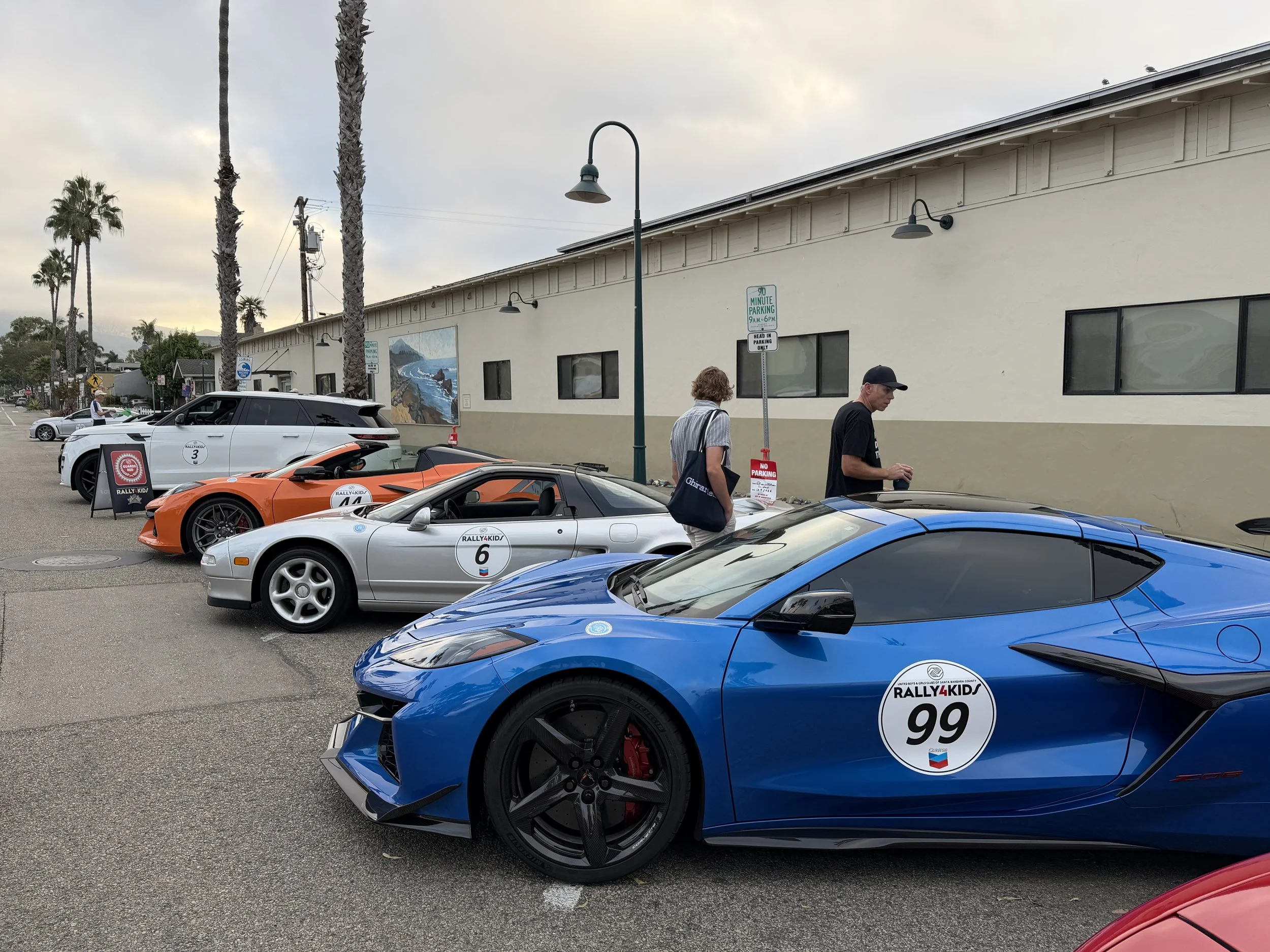 blue-corvette-number-99-beside-parked-rally-cars--13fe03d7.jpeg