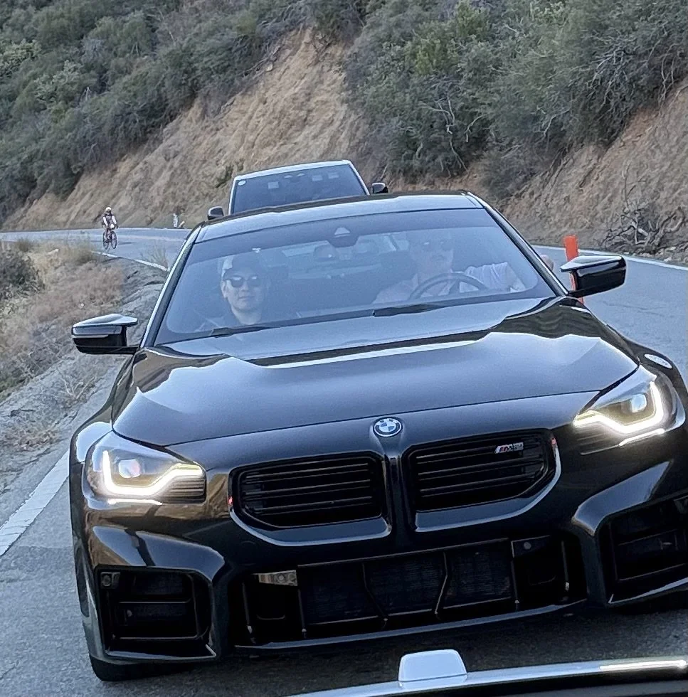 black-bmw-m2-coupe-driving-on-winding-road--40f8d335.jpeg