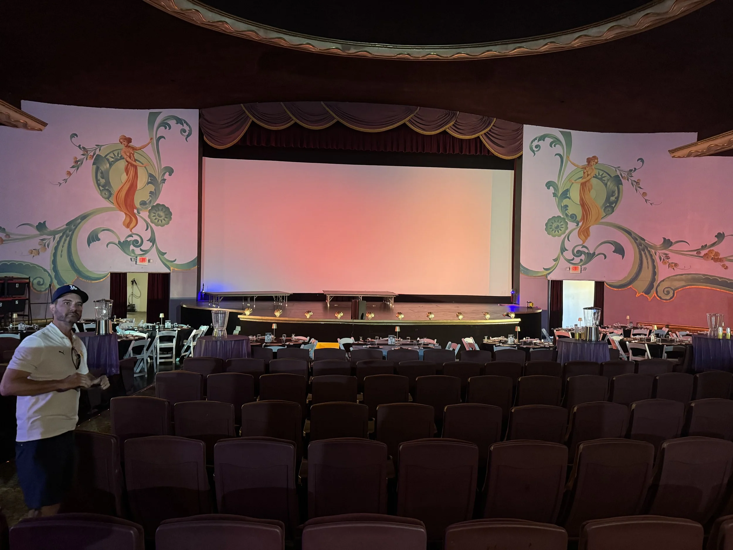man-in-white-shirt-and-blue-cap-in-empty-theater--ead24643.jpeg