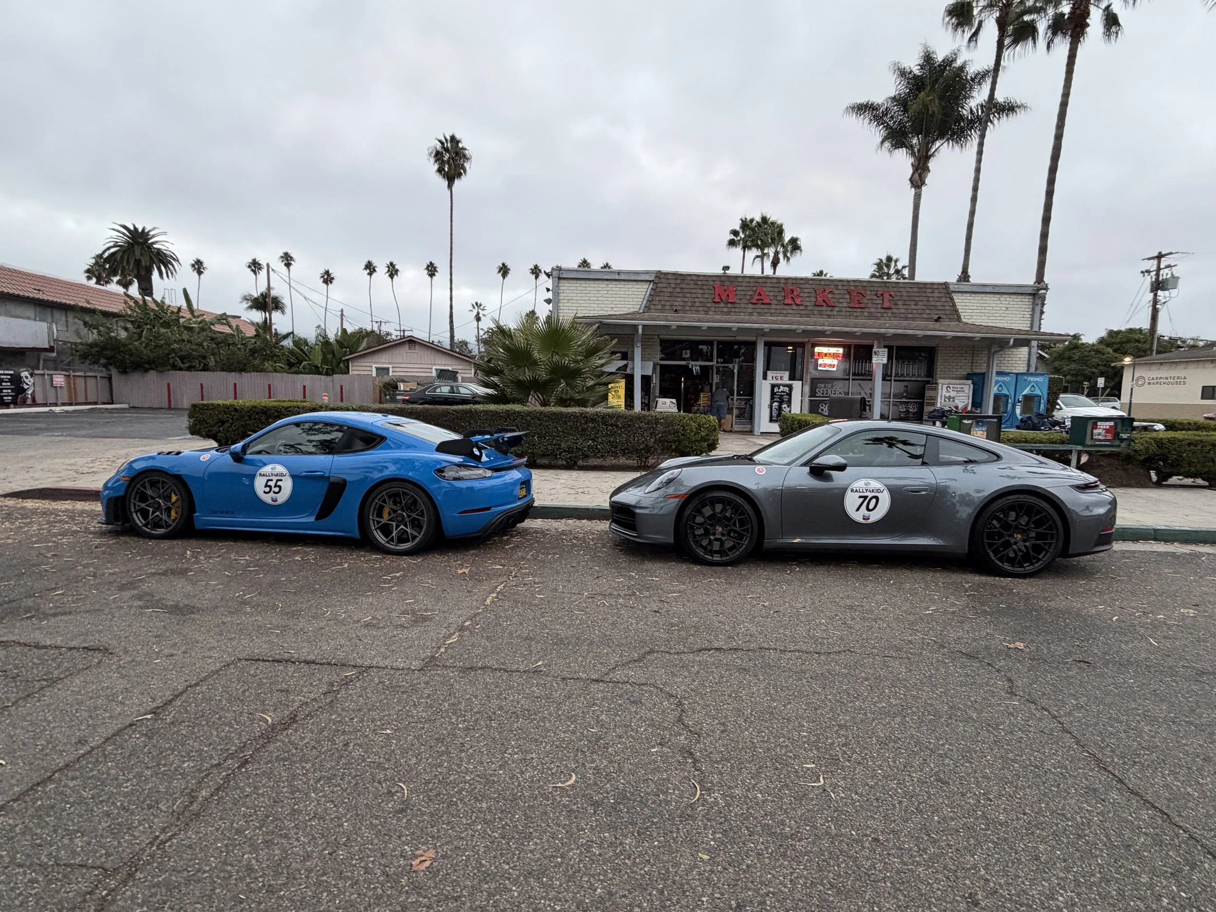 blue-and-silver-numbered-sports-cars-outside-a-restaurant--ab9a0b1e.jpeg