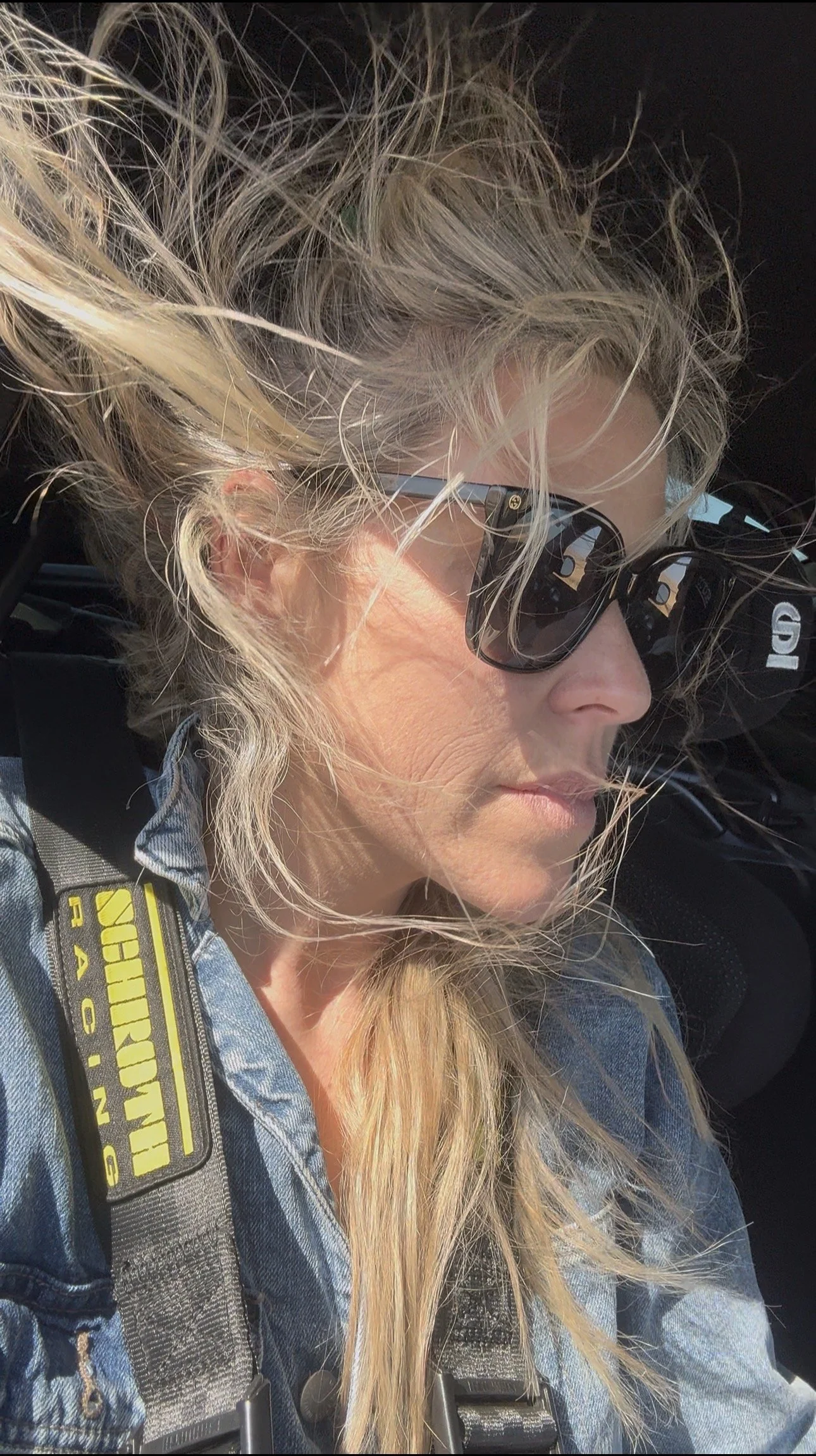 blonde-woman-in-denim-jacket-and-sunglasses-with-windblown-hair--cd1903dc.jpeg