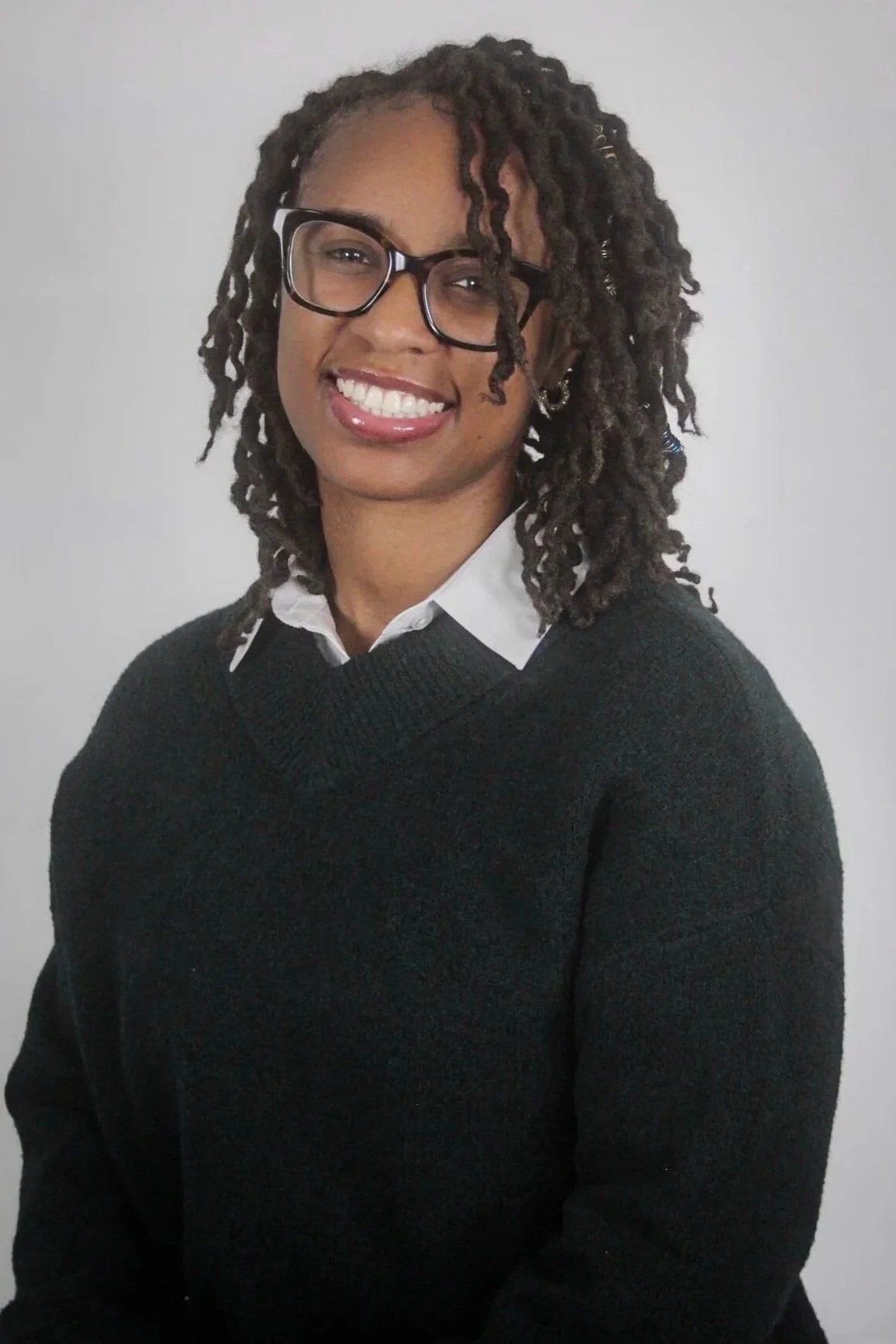 “Professional headshot of Jacael Wallace, a DMV‑based family educator specializing in sleep consulting, parent coaching, and postpartum support.”
