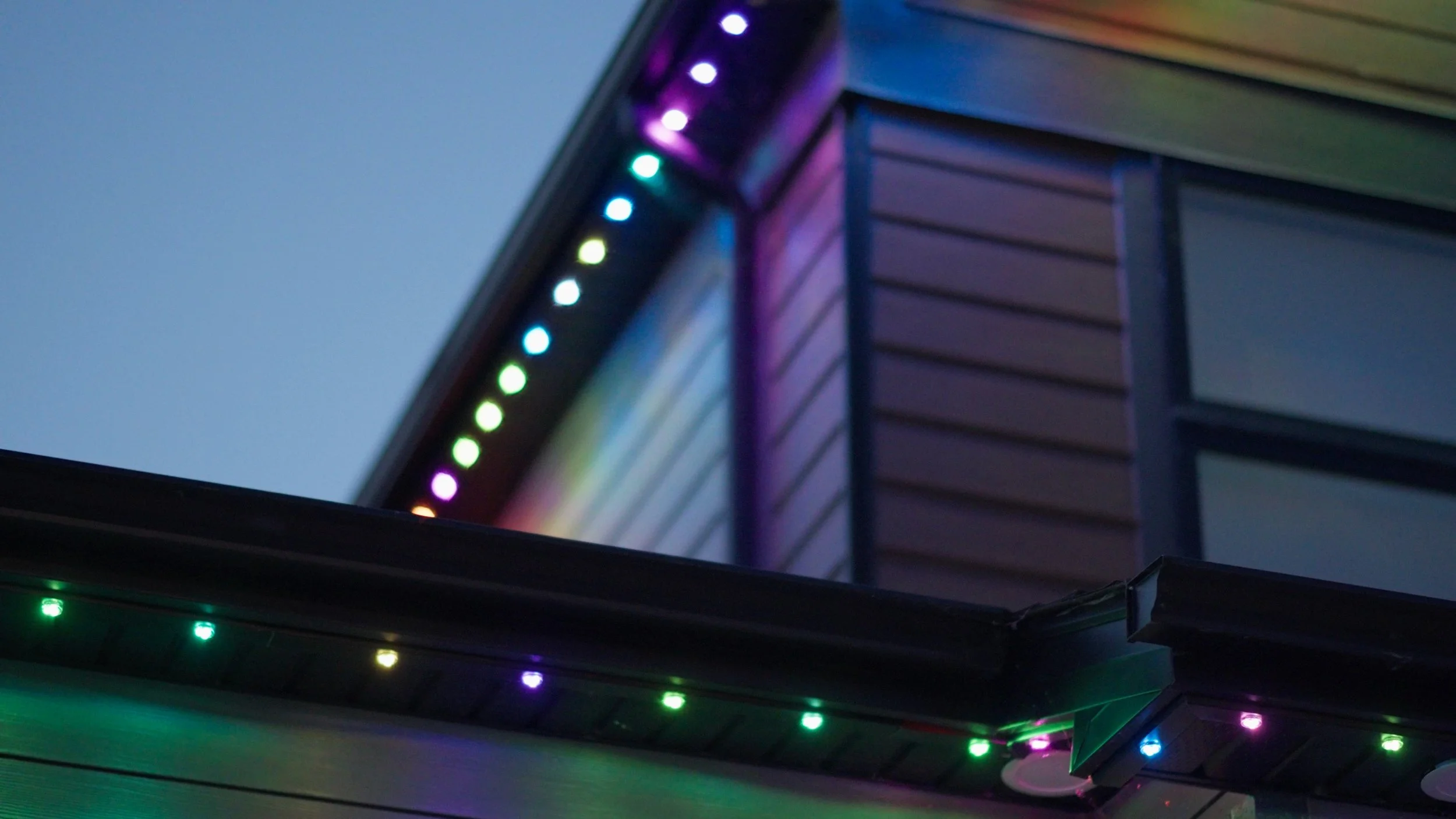 Permanent lighting, JellyFish and WATTS , illuminated by LED lighting along the edges of the roof, soffits and walls in the Denver Colorado area