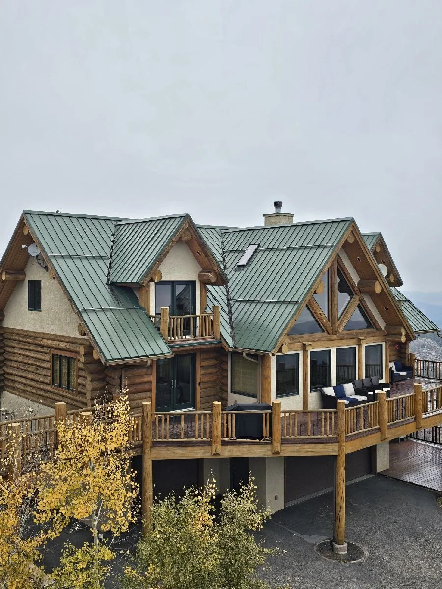 New metal roof installation and seamless gutter system on Colorado mountain home by Averra Exteriors