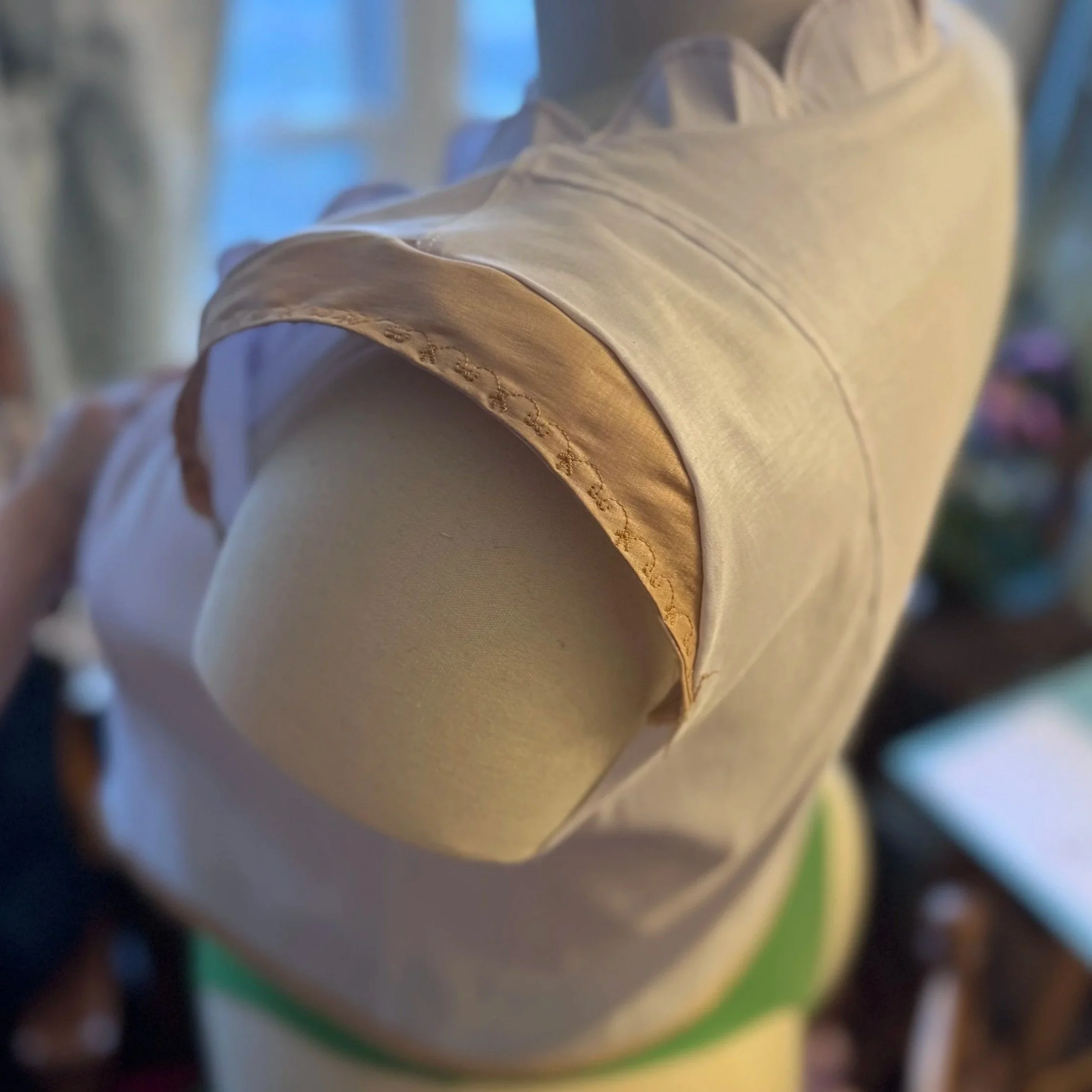 View of jacket cap sleeve detail when 3/4 sleeves are detached.