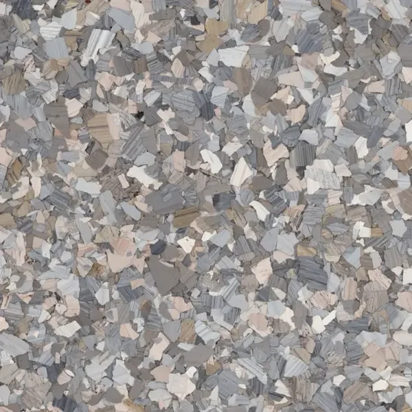 Close-up of small, irregularly shaped rock or mineral fragments in shades of gray, beige, white, and brown.