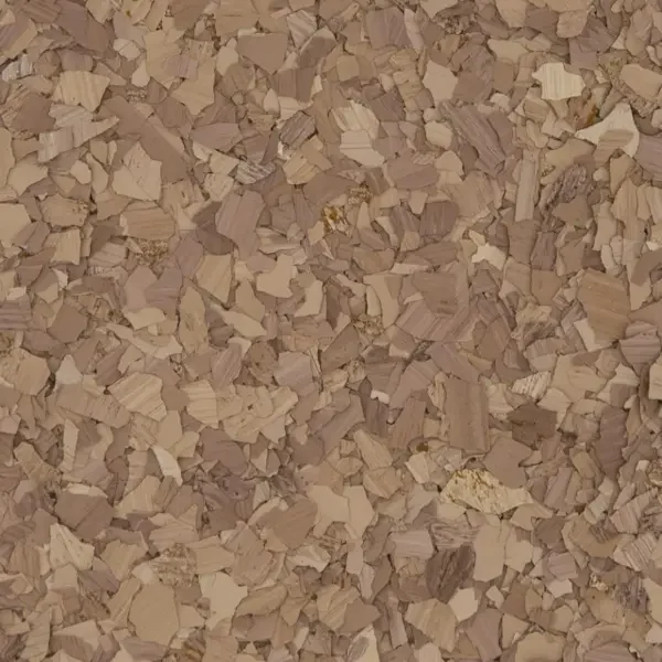 Close-up of a surface covered with small, irregularly shaped wood chips or flakes.