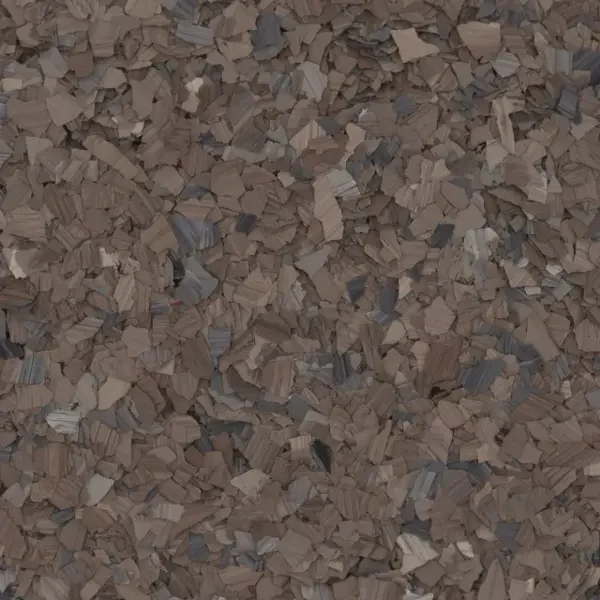 Close-up of a surface covered with small, irregular wood epoxy floor flakes.