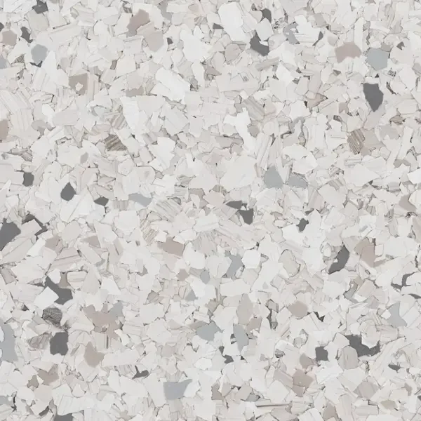 Close-up of terrazzo flooring with white, gray, and black epoxy floor flakes.