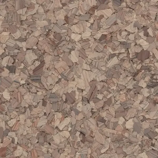 Close-up view of wood shavings or chips in various light browns and beige colors.