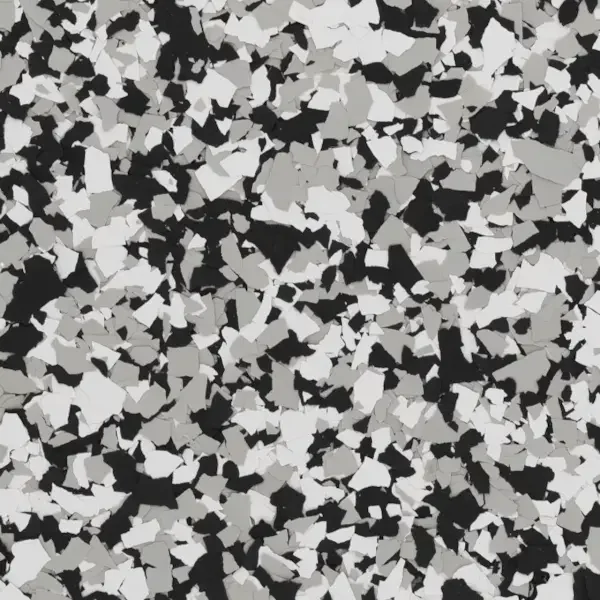 Close-up of a speckled epoxy floor garage with black, white, and gray flecks.