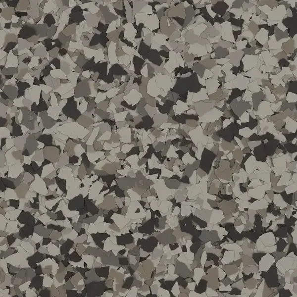 Close-up of a speckled surface with black, gray, and white irregularly shaped particles.