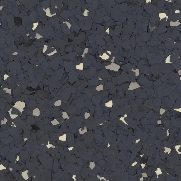 Close-up of black rubber granules with some white specks used in epoxy floors.