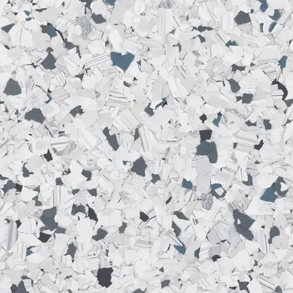 Close-up of shredded epoxy floor flakes in white and dark gray colors.