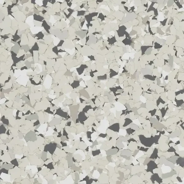 Close-up of a speckled pattern with white, gray, and black irregular epoxy floor flakes, resembling terrazzo flooring or a similar composite material.