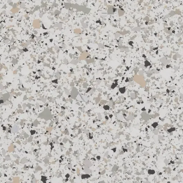 Close-up of a speckled granite countertop with gray, black, white, and beige mineral fragments.