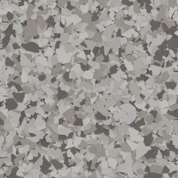 Close-up of a textured surface with scattered irregular white, gray, and silver fragments.