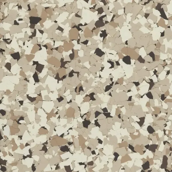 Close-up of multicolored terrazzo flooring with scattered small epoxy floor flakes of beige, white, brown, and black.
