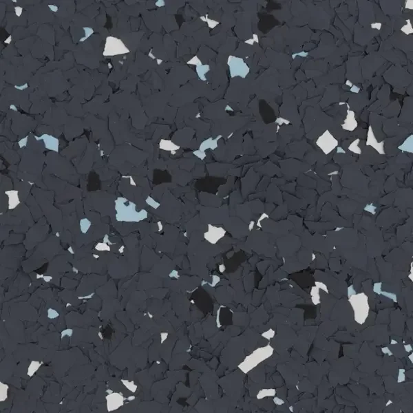 Close-up view of black and blue speckled epoxy flooring.