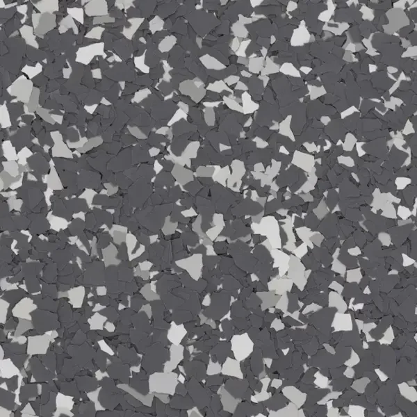 Close-up of black, white, and gray speckled epoxy flooring.