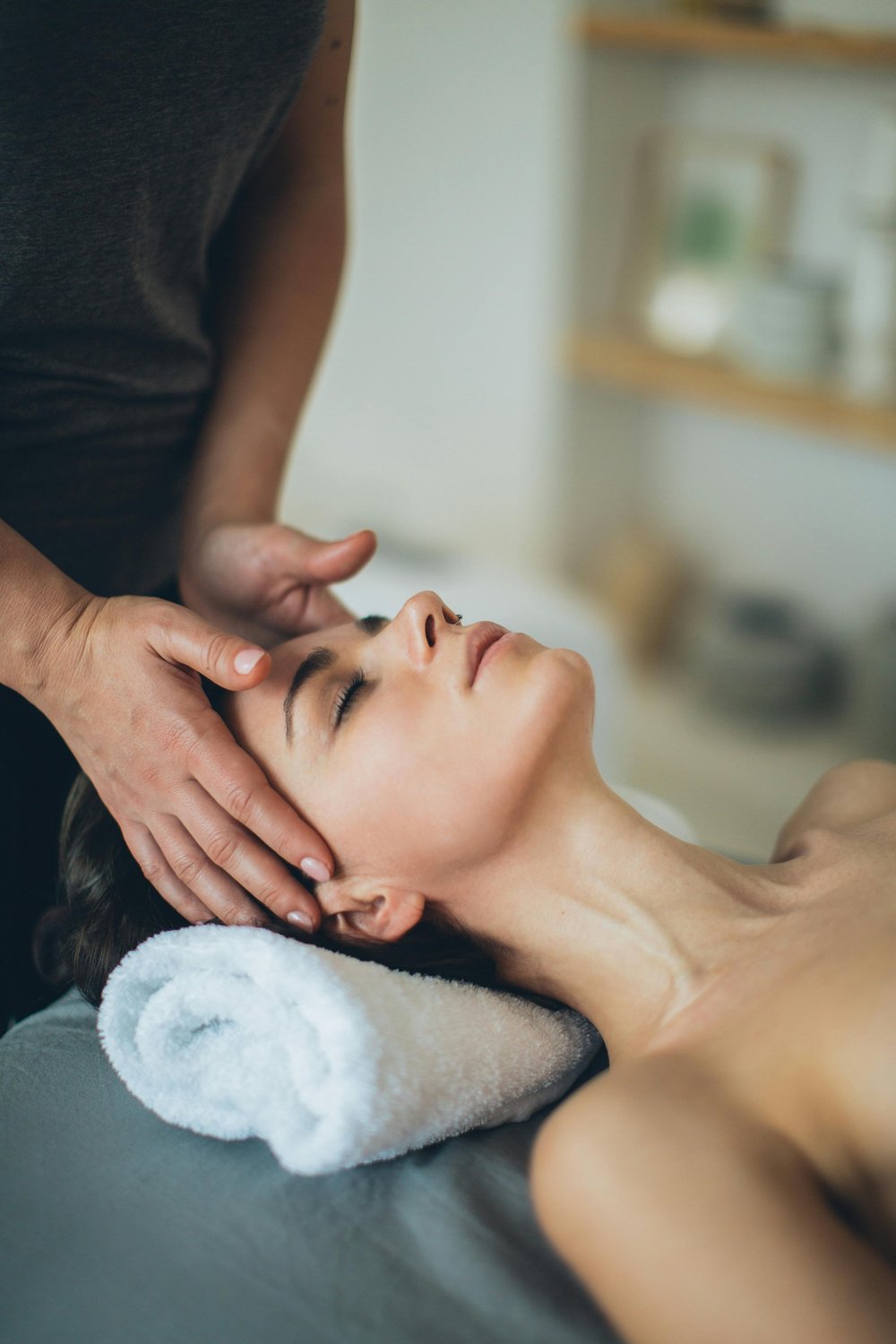 Therapist working on a client's temples
