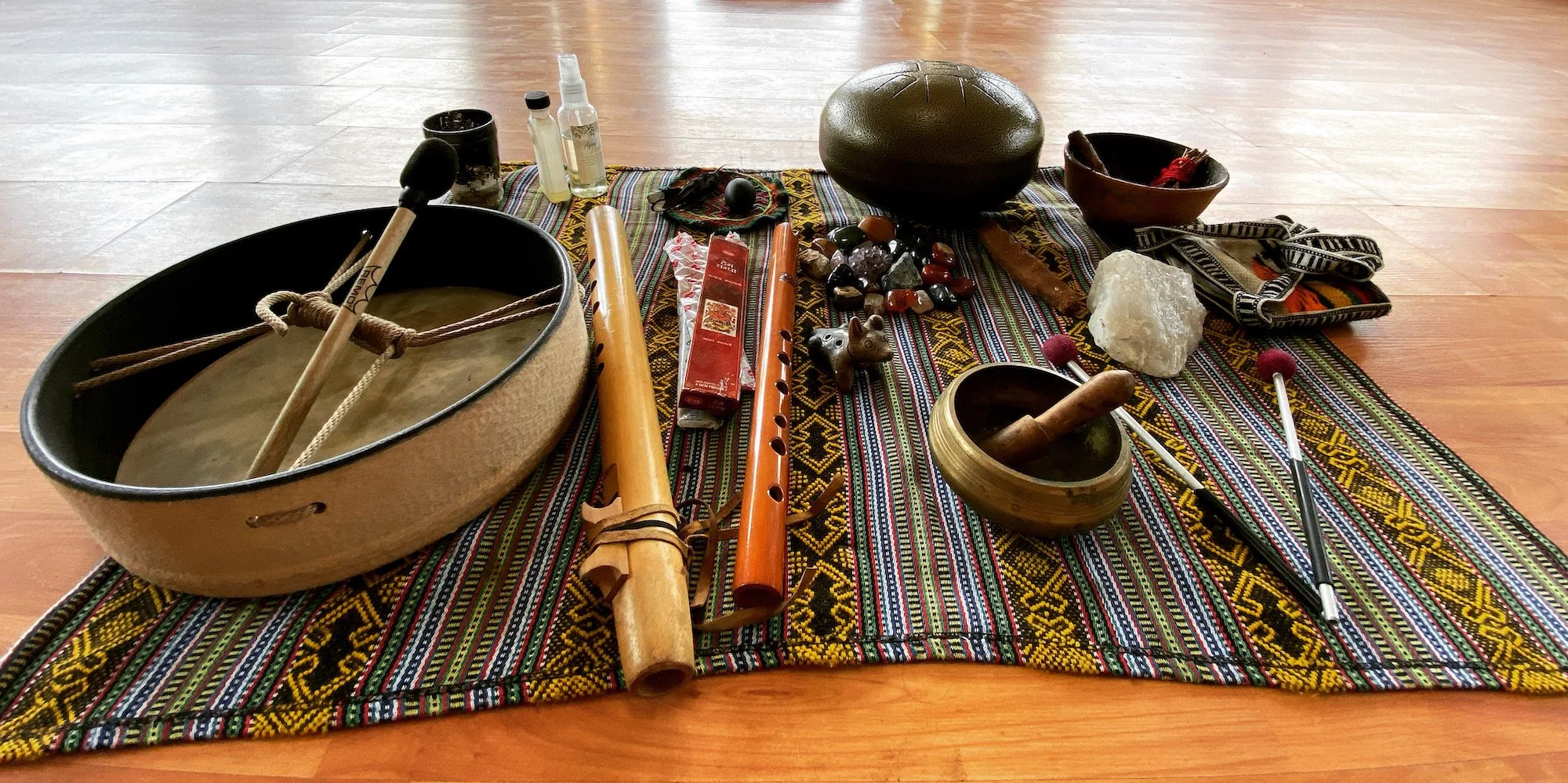 Ceremonial instruments and sacred tools used during retreats to support healing, grounding, and guided inner work